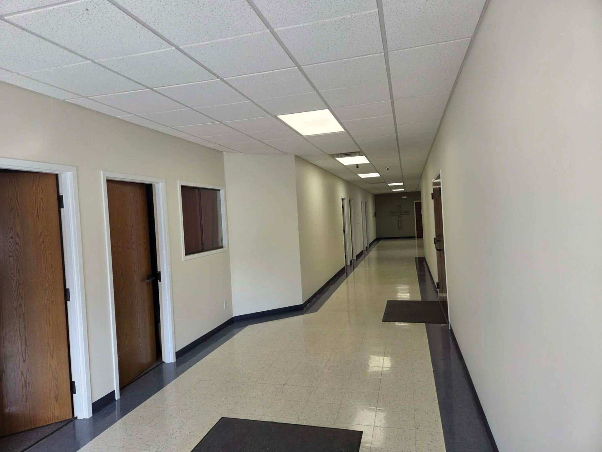 Painted commercial hallway with clean white walls