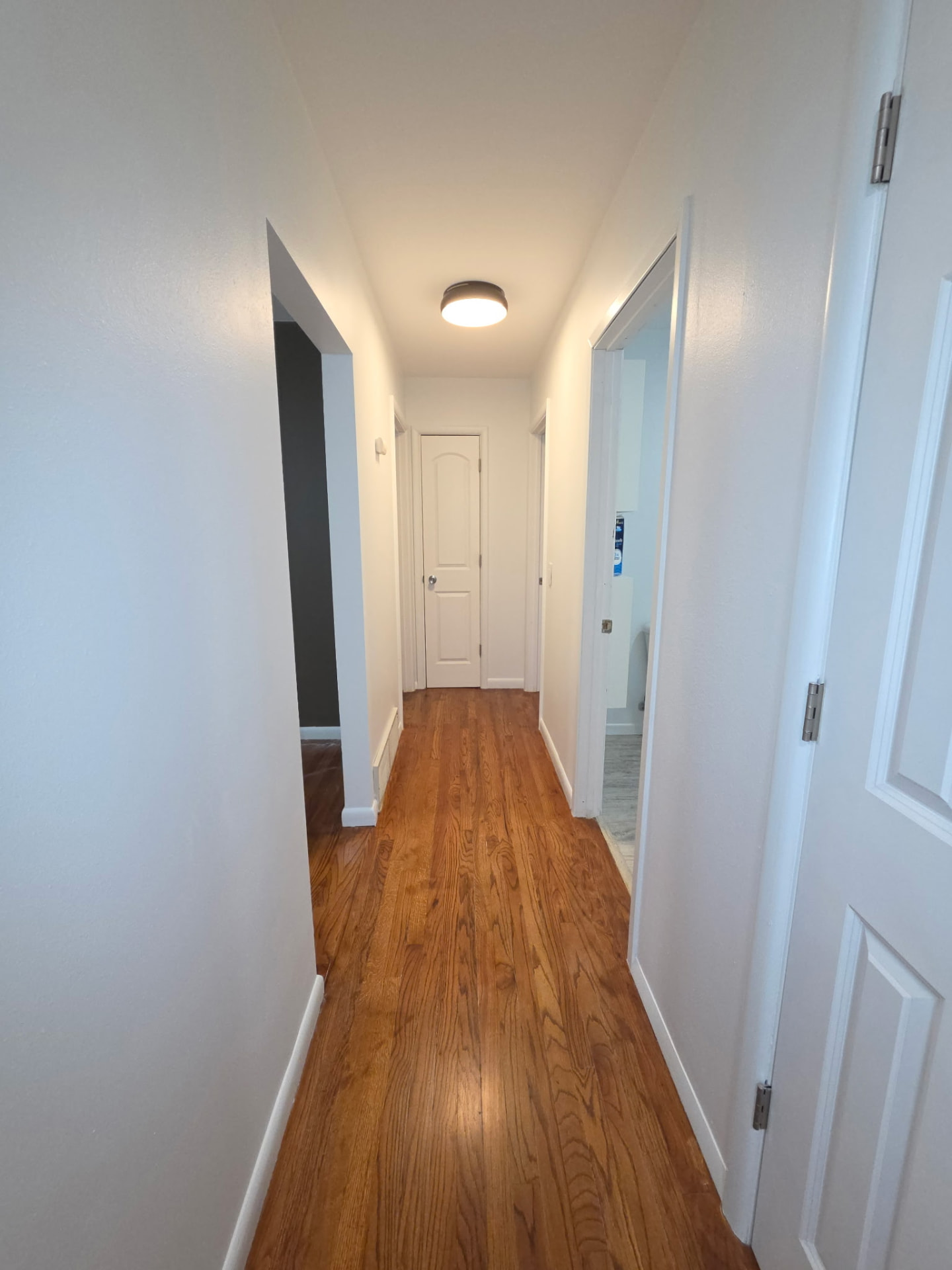 After painting: finished white hallway walls and trim